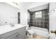 Clean bathroom with modern vanity, tile backsplash and shower over tub at 3304 Vancouver Ave, Deltona, FL 32738
