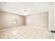 Large bedroom with tile floors and a window for natural light at 3304 Vancouver Ave, Deltona, FL 32738