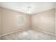 Neutral bedroom featuring a ceiling fan and carpeted flooring, lit by a window at 3304 Vancouver Ave, Deltona, FL 32738