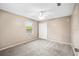 This bedroom is carpeted and has a ceiling fan, closet, and window at 3304 Vancouver Ave, Deltona, FL 32738