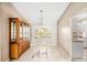 Dining room featuring tile floors, a chandelier and a bay window for natural light at 3304 Vancouver Ave, Deltona, FL 32738