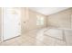 Open foyer with white front door and tile floors, with a decorative accent at 3304 Vancouver Ave, Deltona, FL 32738
