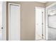 Neutral hallway with tile floors and two visible doors and doorways at 3304 Vancouver Ave, Deltona, FL 32738