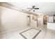 Spacious living room with staircase, tile floors, and neutral paint at 3304 Vancouver Ave, Deltona, FL 32738