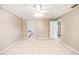 Bright main bedroom featuring tile floors, and ensuite bath at 3304 Vancouver Ave, Deltona, FL 32738