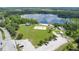 A scenic park featuring a sandy volleyball court, beach, and lakeside picnic area provides a recreational oasis at 3431 Hunt Ln, Oviedo, FL 32765
