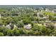 Aerial view of a home nestled among lush trees and greenery at 3431 Hunt Ln, Oviedo, FL 32765