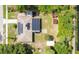 Drone view of the house showing the solar panels and back yard storage sheds at 3431 Hunt Ln, Oviedo, FL 32765