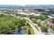 A bustling campus featuring a parking garage, academic buildings, and lush greenery creates an engaging atmosphere at 3431 Hunt Ln, Oviedo, FL 32765
