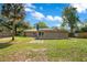 Expansive backyard with lush green grass and a patio, perfect for outdoor entertaining at 3431 Hunt Ln, Oviedo, FL 32765