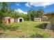 Large backyard with mature trees and plenty of space for gardening or recreation at 3431 Hunt Ln, Oviedo, FL 32765