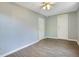 Neutral bedroom featuring a ceiling fan and wood-look flooring at 3431 Hunt Ln, Oviedo, FL 32765