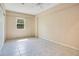 Bedroom with tile flooring, light walls, a window, and ample space for furniture at 3431 Hunt Ln, Oviedo, FL 32765