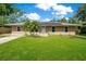 Inviting single-story home with solar panels and a well-maintained lawn at 3431 Hunt Ln, Oviedo, FL 32765