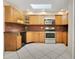 Charming kitchen with wood cabinetry, stainless steel appliances, and ample counter space at 3431 Hunt Ln, Oviedo, FL 32765
