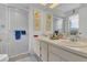 Bathroom featuring dual sinks, a large mirror, and a glass-enclosed shower at 3501 Danby Ct, Orlando, FL 32812