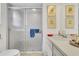 Bathroom featuring a white vanity, a large mirror, and a glass-enclosed shower at 3501 Danby Ct, Orlando, FL 32812