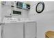 Convenient laundry room with modern washer and dryer, and practical storage solutions at 3501 Danby Ct, Orlando, FL 32812