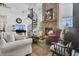 Cozy living room featuring a brick fireplace, spiral staircase, and comfortable seating at 3501 Danby Ct, Orlando, FL 32812