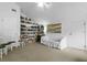 Inviting living room featuring a built-in bookcase and a comfortable white sofa at 3501 Danby Ct, Orlando, FL 32812