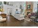 Open-concept living room featuring a soaring ceiling, spiral staircase, fireplace, and beautiful wood floors at 3501 Danby Ct, Orlando, FL 32812