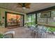 Covered brick patio featuring comfortable seating and view to the kitchen at 3501 Danby Ct, Orlando, FL 32812