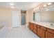 Large primary bathroom with double vanity sinks, tiled floors, walk-in shower and tub creating a clean, spa-like ambiance at 357 Fairway Pointe Cir, Orlando, FL 32828