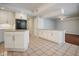 Bright kitchen features granite countertops, white cabinets, and stainless steel appliances at 357 Fairway Pointe Cir, Orlando, FL 32828