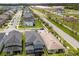 Aerial view of homes in a suburban neighborhood, with manicured lawns and roadways nearby development at 3804 Corona Ct, Sanford, FL 32773