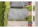 Aerial view of a home featuring a dark roof, green lawn and adjacent homes in a planned community at 3804 Corona Ct, Sanford, FL 32773