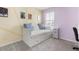 Cozy bedroom featuring a white daybed, soft carpet, and a charming color scheme at 3804 Corona Ct, Sanford, FL 32773