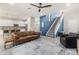 Open-concept living room with a staircase, a cozy seating area, and views of the modern kitchen at 3804 Corona Ct, Sanford, FL 32773
