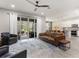 Bright open-concept living room with sliding glass doors leading to an outdoor patio at 3804 Corona Ct, Sanford, FL 32773
