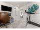 This office features a view into the living room, modern art, and a treadmill at 3804 Corona Ct, Sanford, FL 32773