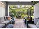 Comfortable screened porch with outdoor seating, plants, and a barbecue grill at 3804 Corona Ct, Sanford, FL 32773