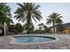 Inviting community hot tub surrounded by brick pavers and lush greenery, creating a relaxing and private oasis at 3963 Turow Ln, Orlando, FL 32828