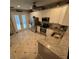 Bright kitchen features granite countertops, stainless steel appliances, and ample cabinet space for storage at 3963 Turow Ln, Orlando, FL 32828