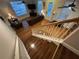 Bright living room showing leather sofas, wood floors, ceiling fans, and a decorative front door at 3963 Turow Ln, Orlando, FL 32828