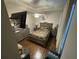 Comfortable main bedroom featuring wood floors, a ceiling fan, and neutral paint at 3963 Turow Ln, Orlando, FL 32828