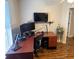 A tidy office featuring a desk, a ceiling fan, and hardwood flooring at 3963 Turow Ln, Orlando, FL 32828