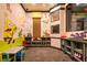 Bright playroom featuring colorful cartoon wall art and lots of kid-friendly storage for toys and activities at 3963 Turow Ln, Orlando, FL 32828