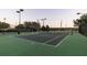 Well-maintained tennis court with professional surfacing, lighting, and perimeter fencing for year-round play at 3963 Turow Ln, Orlando, FL 32828