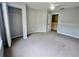 Bedroom featuring neutral carpet, ceiling fan, closet, and neutral color scheme at 4010 Santa Maria Dr # 106, Kissimmee, FL 34741