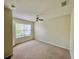 Bedroom with natural light from a window and neutral colored carpet at 4010 Santa Maria Dr # 106, Kissimmee, FL 34741