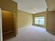 Spacious bedroom with neutral carpet, closet, ceiling fan and big window for natural lighting at 4010 Santa Maria Dr # 106, Kissimmee, FL 34741