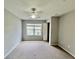 Spacious bedroom with natural light, neutral carpet and a ceiling fan at 4010 Santa Maria Dr # 106, Kissimmee, FL 34741