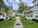 Beautiful shot of the community featuring sidewalks, green spaces and colorful townhomes at 4010 Santa Maria Dr # 106, Kissimmee, FL 34741