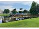 Community dock with wood railings overlooking the pond with community amenities at 4010 Santa Maria Dr # 106, Kissimmee, FL 34741