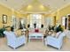 Bright and inviting lobby with comfortable seating and elegant decor in a calming color palette at 4010 Santa Maria Dr # 106, Kissimmee, FL 34741