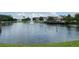 Waterfront community with pond, fountain and covered seating areas at 4010 Santa Maria Dr # 106, Kissimmee, FL 34741